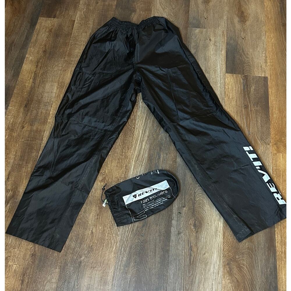 REV-IT Rain Trousers 100% Waterproof, Lightweight, Transport Bag Included,Logo